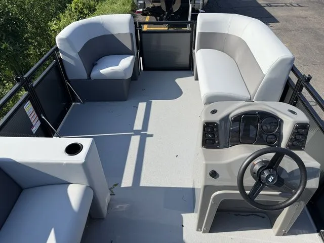 Slide: The Image of The image shows the deck of a 2026 Angler Quest 7515 Leisure Cruise boat with gray seating. - 6