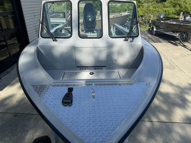 Slide: The Image of The image shows a 2027 Smoker Craft Phantom 18 X2 boat with a sturdy aluminum surface. - 4