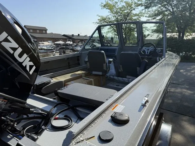 Slide: The Image of The image shows a modern boat with a Suzuki engine, spacious deck, and two seats. - 7