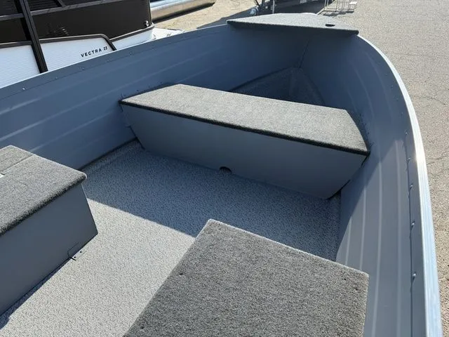 Slide: The Image of The image shows the interior of a Starcraft Seafarer DLX 14 boat with gray seating. - 5