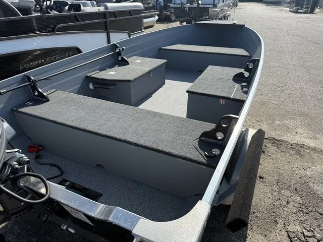 Slide: The Image of The image shows a 2027 Starcraft Seafarer DLX 14 boat with gray seating and storage. - 4