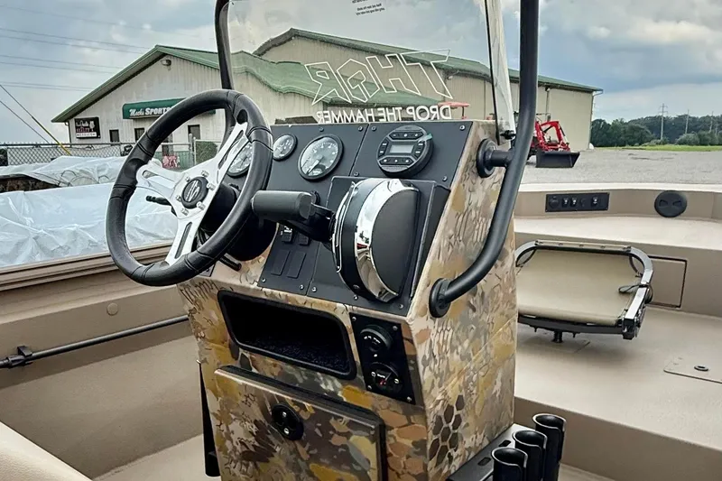 Slide: The Image of Control panel of 2027 Thor LAKE HAMMER 1900 CC boat with camouflage design. - 3