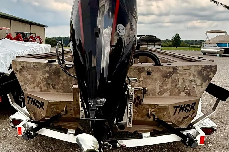 Slide: The Image of 2027 Thor LAKE HAMMER 1900 CC boat with camouflage design and powerful outboard motor. - 5
