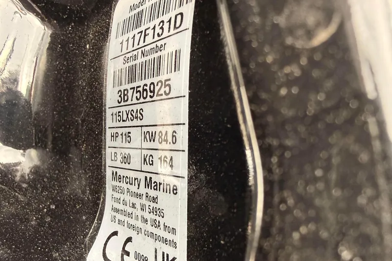 Slide: The Image of Close-up of Mercury Marine engine label, showing model and specifications. - 13