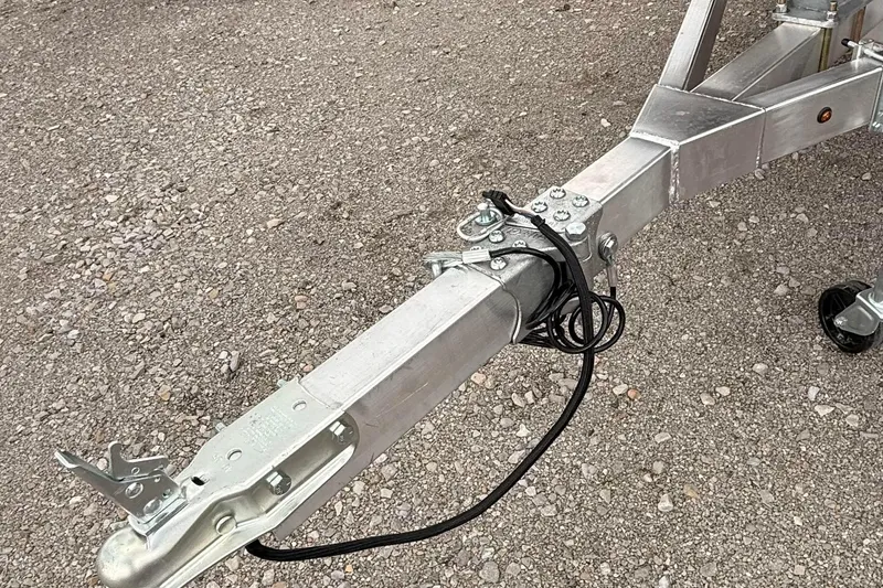 Slide: The Image of Trailer hitch of 2027 Thor LAKE HAMMER 1900 CC on gravel surface. - 8