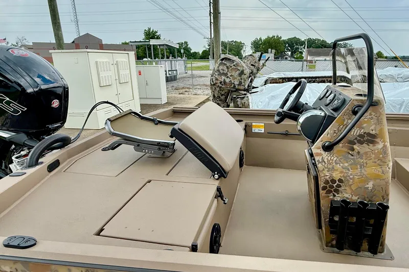 Slide: The Image of 2027 Thor LAKE HAMMER 1900 CC boat interior with camouflage design and modern controls. - 4