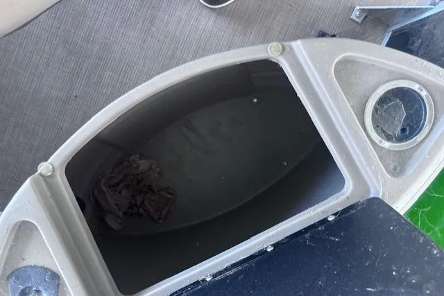 Slide: The Image of Storage compartment on a 2020 Sun Tracker Fishin' Barge 20 DLX boat interior. - 13