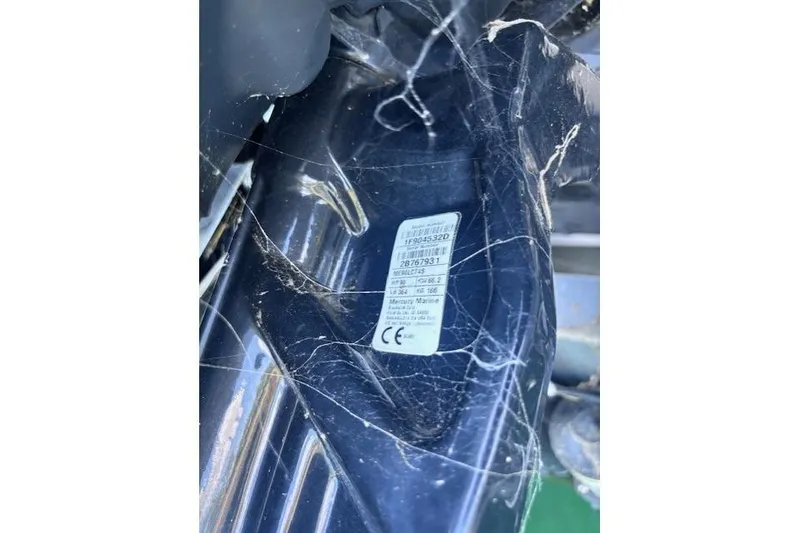 Slide: The Image of Close-up of a 2020 Sun Tracker Fishin' Barge 20 DLX engine label. - 8