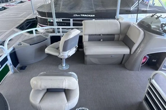 Slide: The Image of 2020 Sun Tracker Fishin' Barge 20 DLX interior with seating and helm station. - 5
