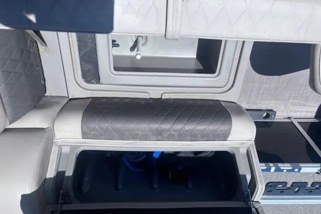 Slide: The Image of Interior view of a 2021 Sun Tracker Fishin' Barge 20 DLX storage compartments. - 76