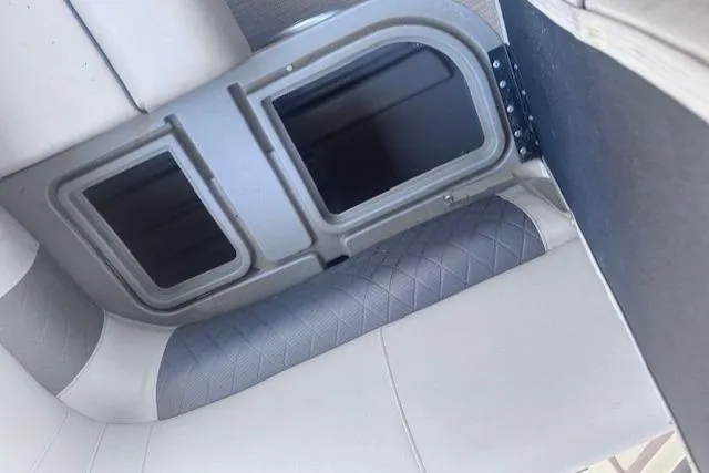 Slide: The Image of Interior seating of 2021 Sun Tracker Fishin' Barge 20 DLX with storage compartments. - 75