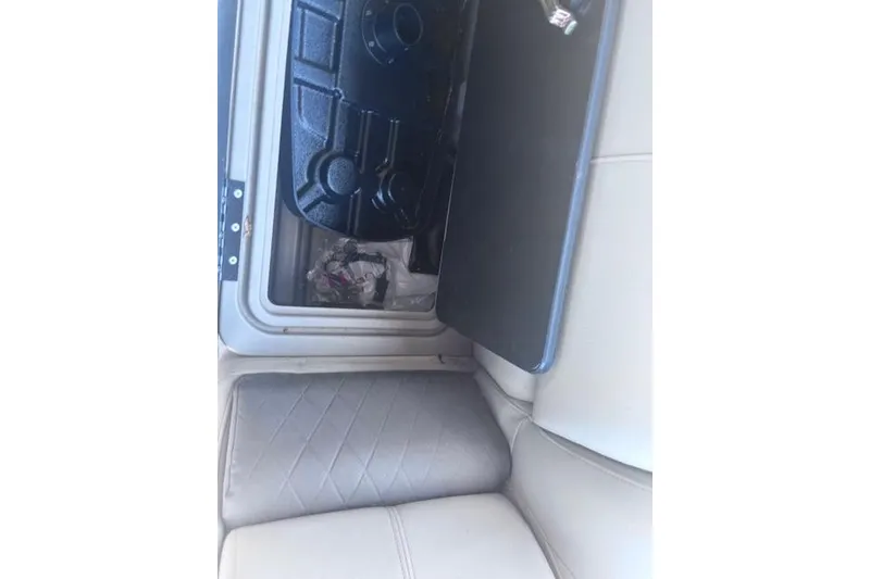 Slide: The Image of Open storage compartment on 2021 Sun Tracker Fishin' Barge 20 DLX boat. - 77