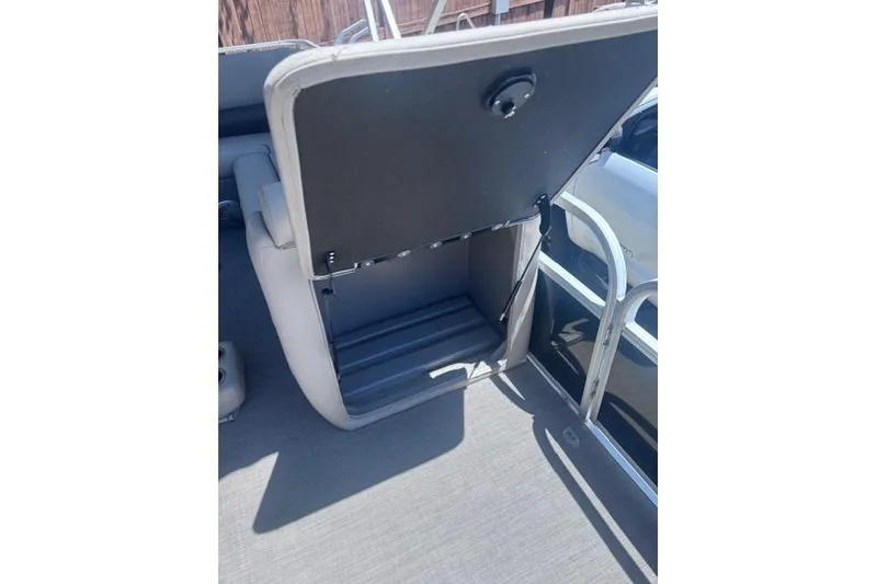 Slide: The Image of Open storage compartment on a 2021 Sun Tracker Fishin' Barge 20 DLX pontoon boat. - 74