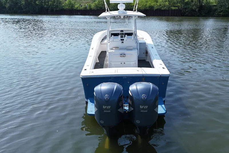 Slide: The Image of A 2010 Regulator 34SS on calm water with twin V8 engines. - 8