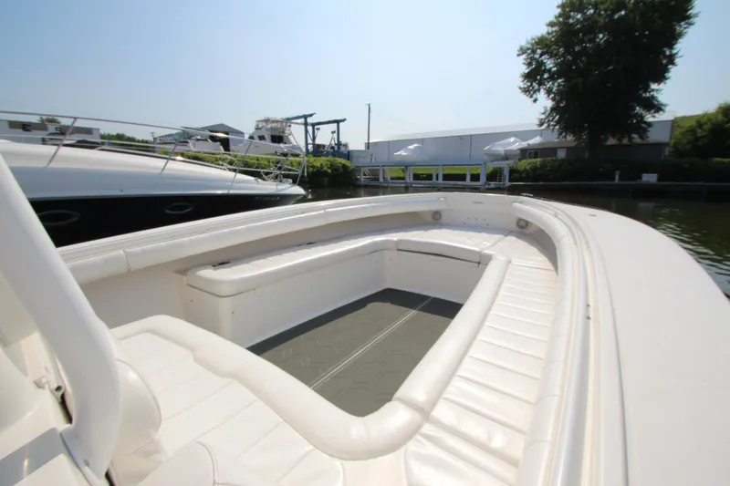 Slide: The Image of The image shows the spacious cockpit of a Regulator 34SS boat with white upholstery. - 21