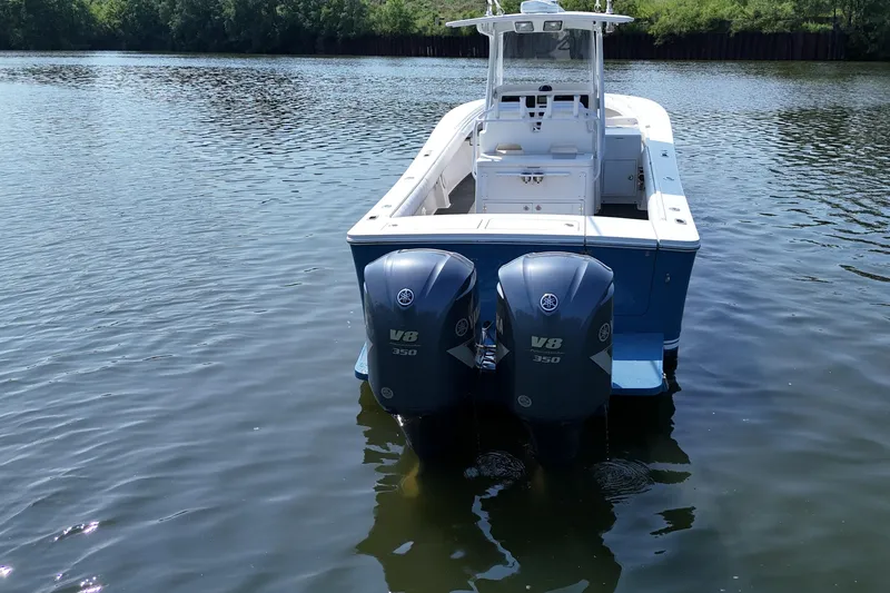 Slide: The Image of A 2010 Regulator 34SS with twin V8 engines on calm water. - 9