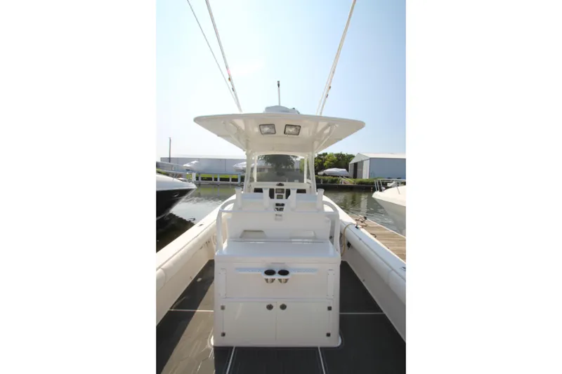 Slide: The Image of A 2010 Regulator 34SS boat with a central helm station and spacious deck. - 25