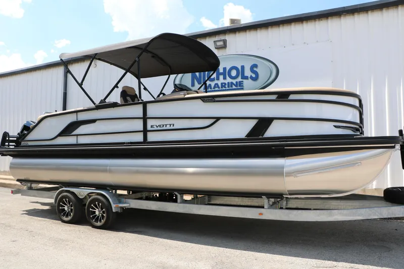 Slide: The Image of 2026 Evotti 725QL pontoon boat on trailer at Nichols Marine dealership. - 24