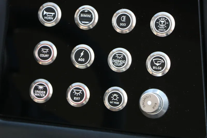 Slide: The Image of Control panel of 2026 Evotti 725QL boat with labeled buttons for various functions. - 50