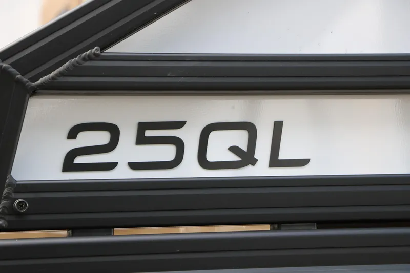 Slide: The Image of Close-up of Evotti 725QL 2026 model badge, displaying "25QL" in bold black font. - 10