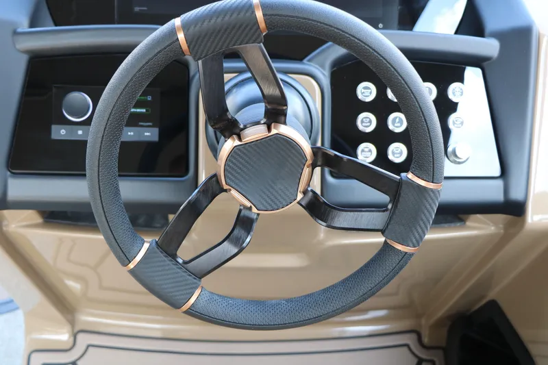 Slide: The Image of Steering wheel of 2026 Evotti 725QL with modern dashboard controls. - 51