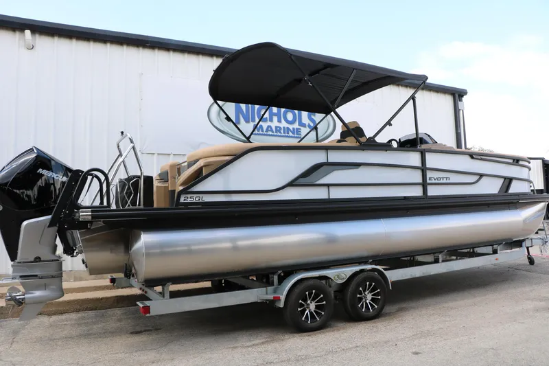 Slide: The Image of 2026 Evotti 725QL pontoon boat on trailer at Nichols Marine dealership. - 11