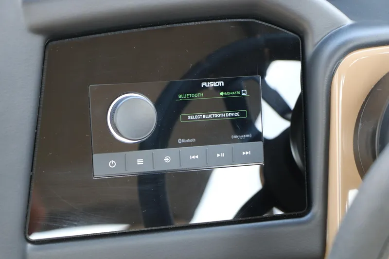 Slide: The Image of Dashboard of 2026 Evotti 725QL featuring a Fusion Bluetooth audio system. - 49