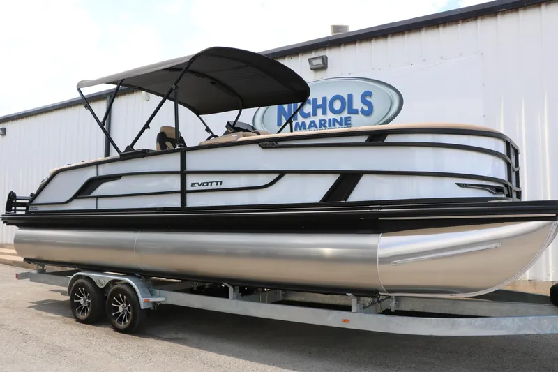 The Image of 2026 Evotti 725QL pontoon boat on trailer at Nichols Marine dealership. - 0