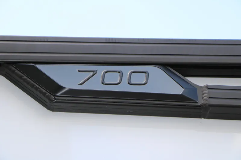 Slide: The Image of Close-up of Evotti 725QL 2026 model badge with "700" marking. - 9
