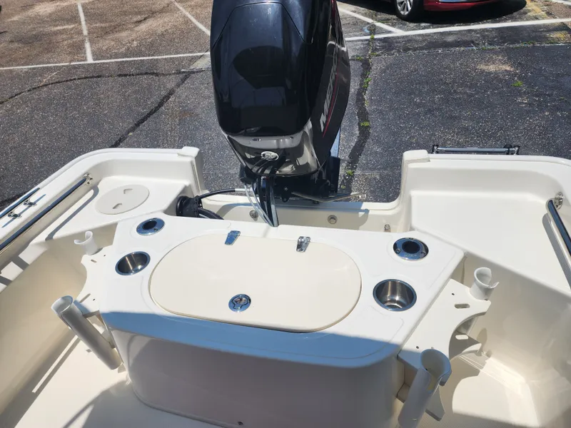 Slide: The Image of The image shows the stern of a 2023 Boston Whaler 150 Montauk boat with an outboard motor. - 6