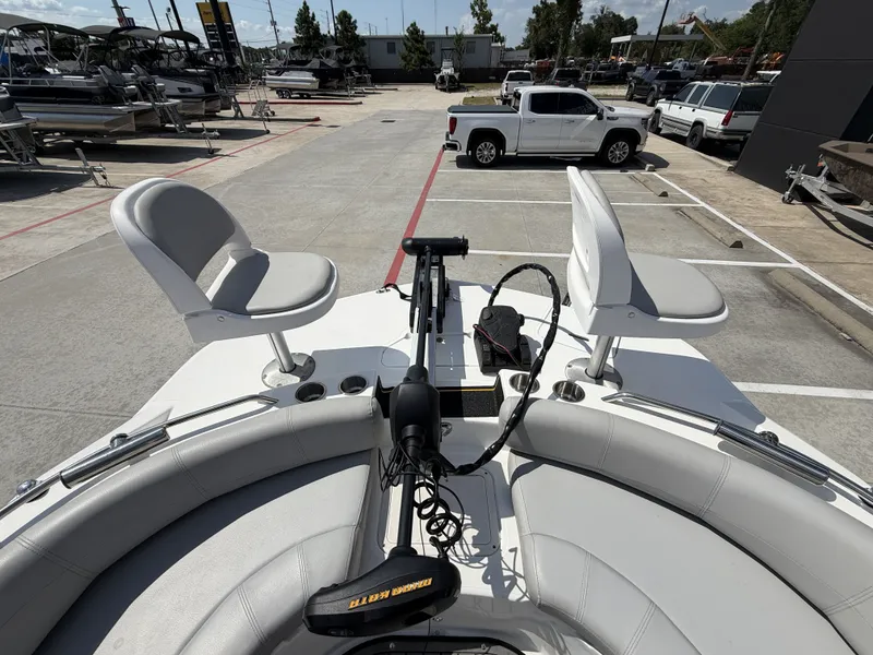 Slide: The Image of The image shows the bow of a Hurricane 201 SS boat with two seats and a motor. - 27