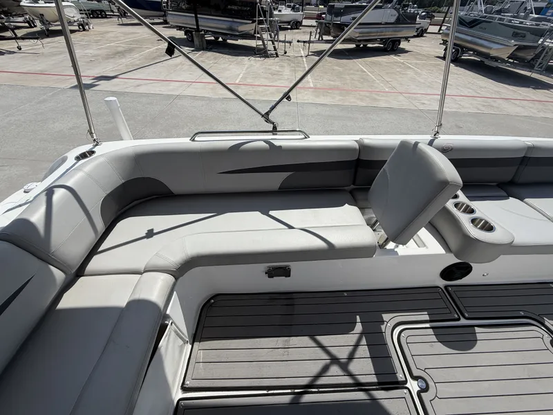 Slide: The Image of The image shows the cockpit of a 2018 Hurricane 201 SS boat with gray upholstery. - 22