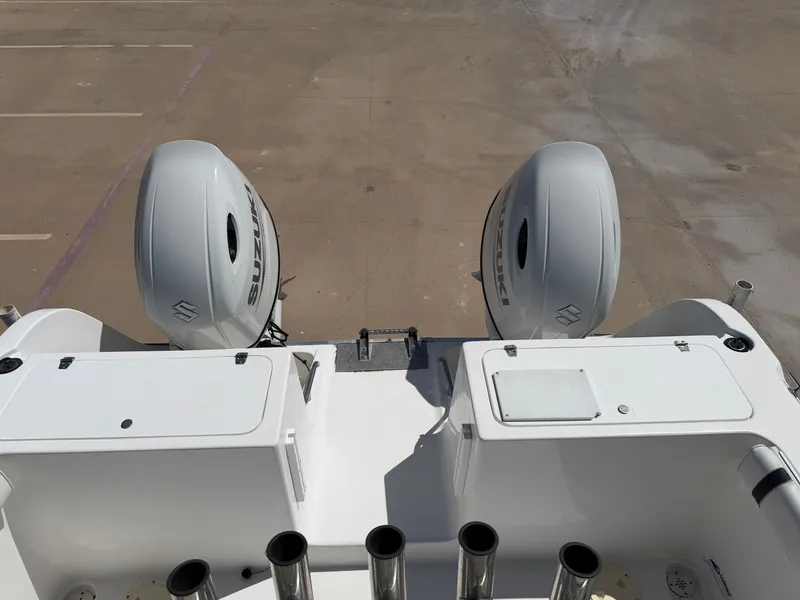 Slide: The Image of Two outboard engines on a boat, positioned on a dry dock. - 32