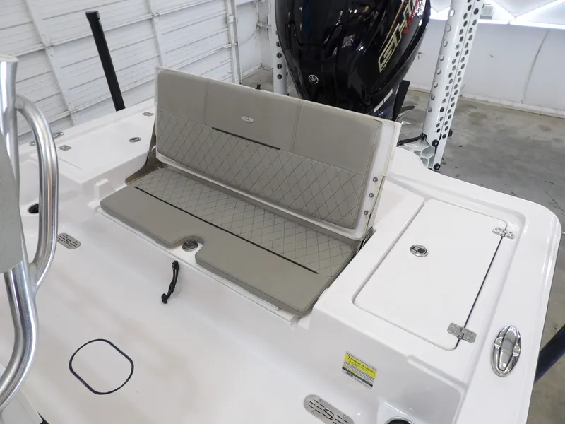 Slide: The Image of The image shows the stern of a 2022 Sportsman Tournament 214 Bay Boat with a folded-up seat. - 17