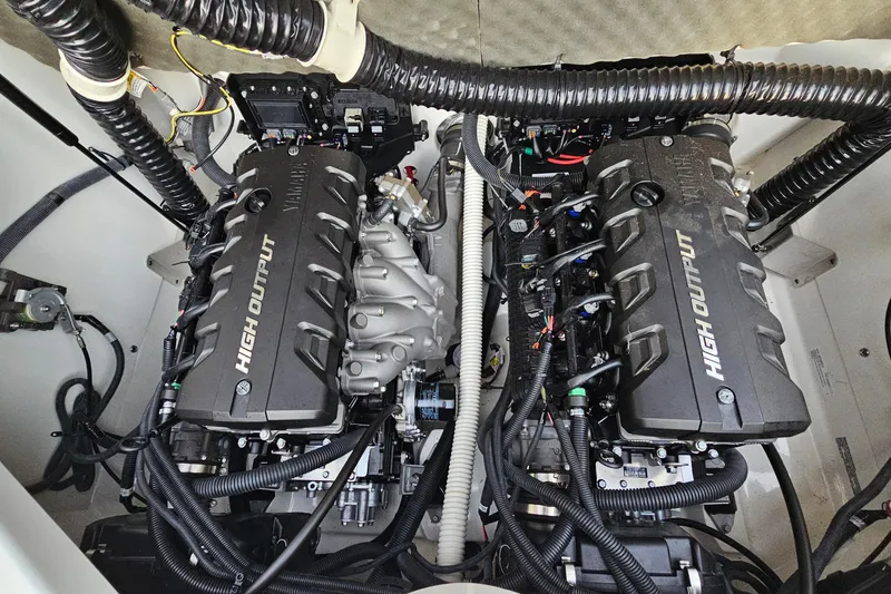 Slide: The Image of 2019 Yamaha Boats 212 Limited engine compartment with dual high-output engines. - 28