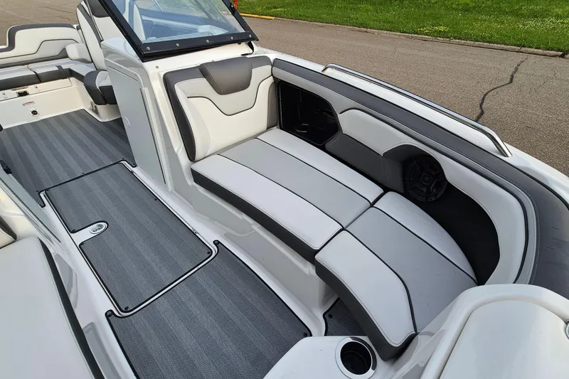 Slide: The Image of 2019 Yamaha Boats 212 Limited interior with gray seating and flooring. - 17