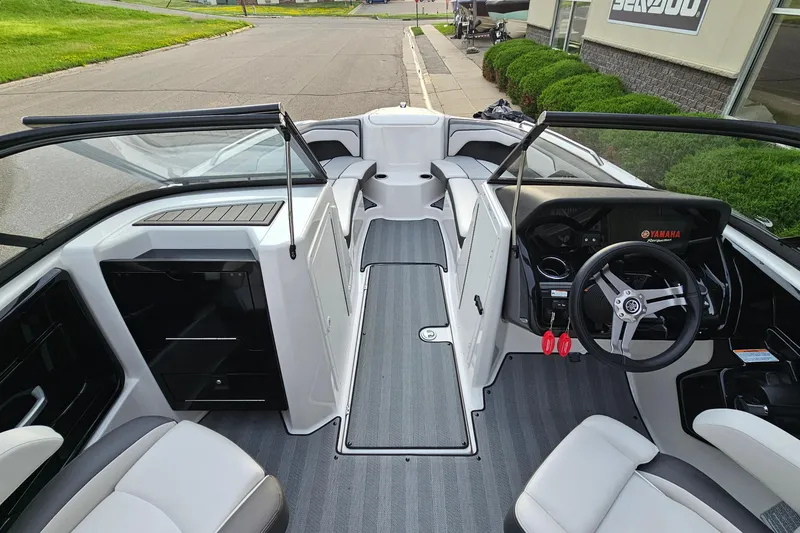 Slide: The Image of 2019 Yamaha Boats 212 Limited interior with sleek design and modern dashboard. - 15