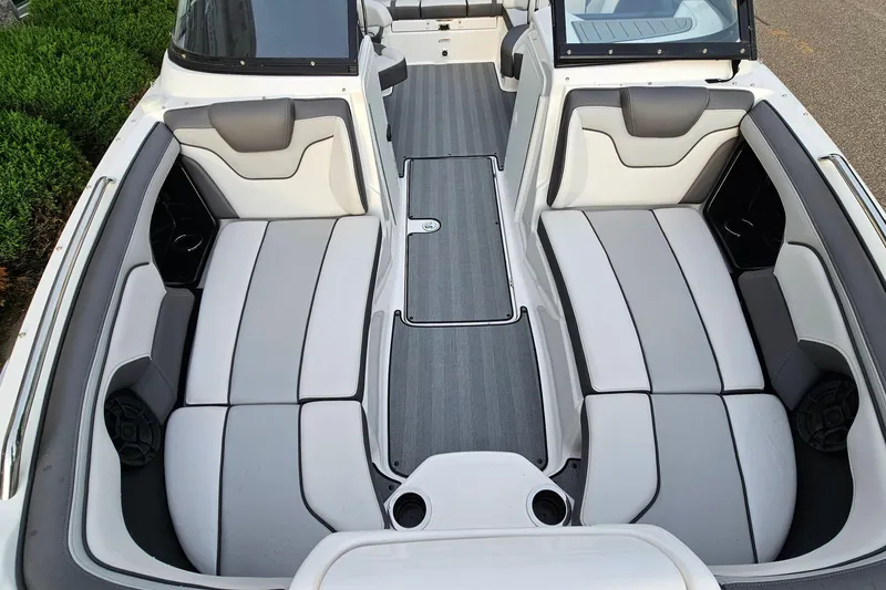 Slide: The Image of 2019 Yamaha Boats 212 Limited interior with spacious seating and sleek design. - 16