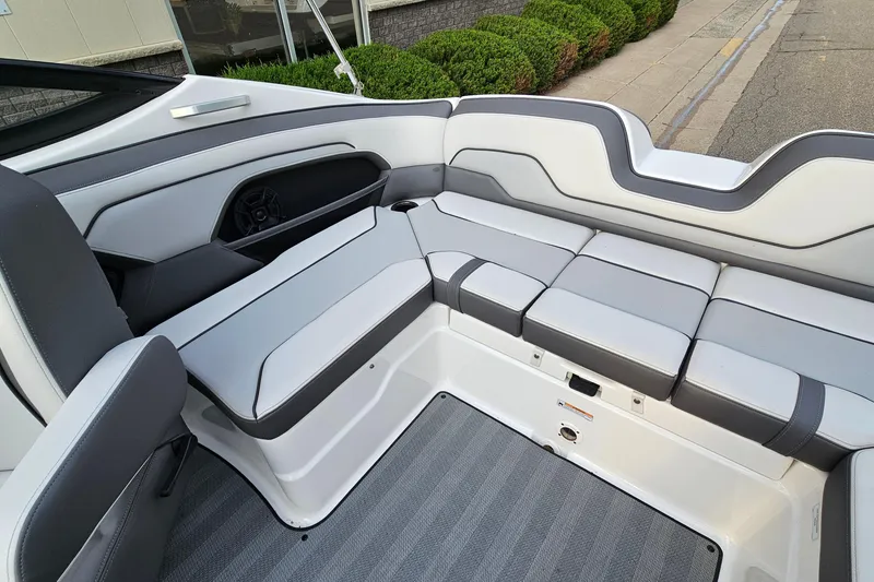 Slide: The Image of Interior seating of 2019 Yamaha Boats 212 Limited, featuring sleek gray and white upholstery. - 10