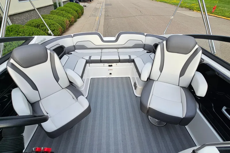 Slide: The Image of 2019 Yamaha Boats 212 Limited interior with sleek, modern seating and spacious layout. - 7