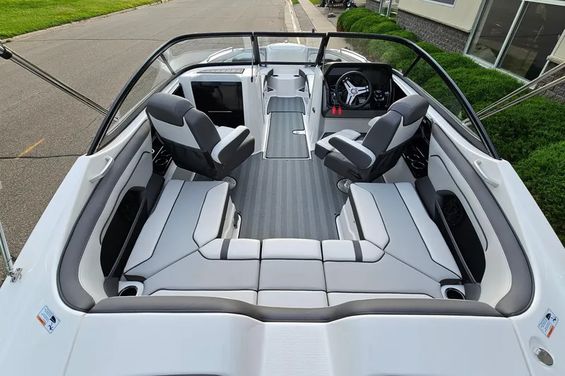 Slide: The Image of 2019 Yamaha Boats 212 Limited interior with sleek seating and modern dashboard design. - 6