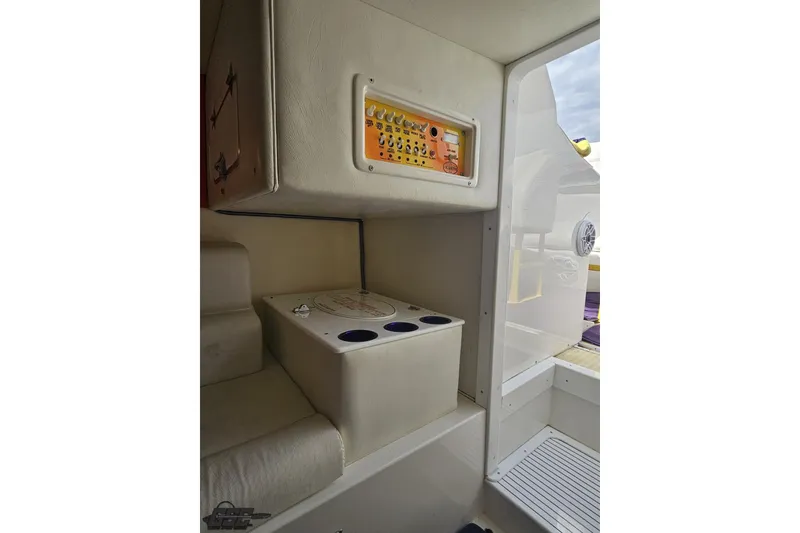 Slide: The Image of Interior view of a 2002 Cigarette 42' Tiger boat, featuring seating and control panel. - 80