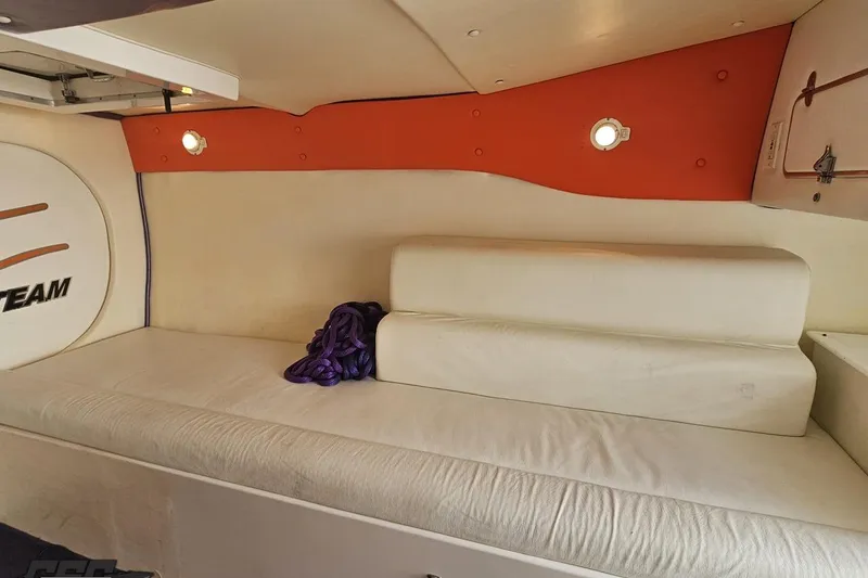 Slide: The Image of Interior cabin of a 2002 Cigarette 42' Tiger boat with white seating. - 79