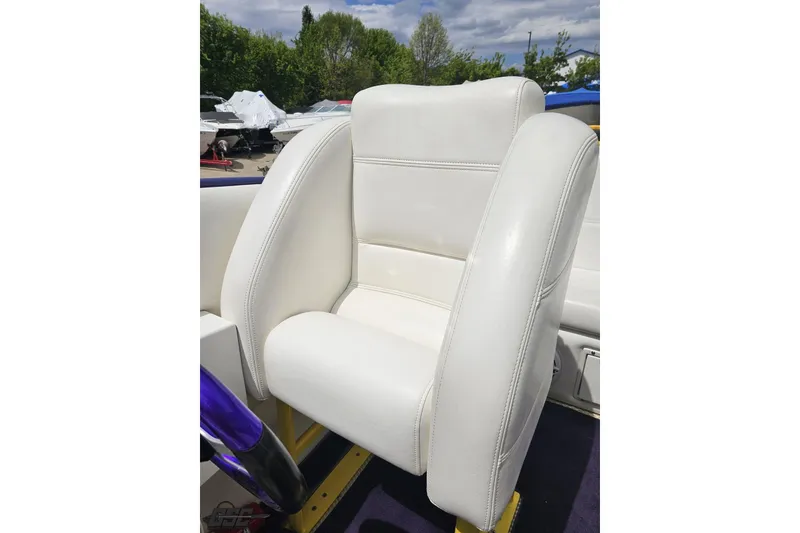 Slide: The Image of White leather seat on a 2002 Cigarette 42' Tiger boat, outdoor setting. - 87