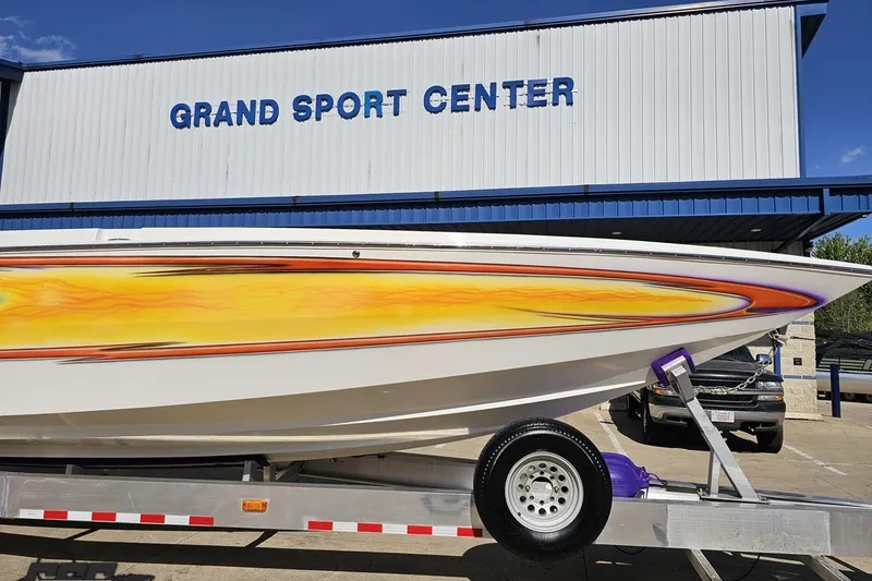 Slide: The Image of 2002 Cigarette 42' Tiger boat with vibrant design at Grand Sport Center. - 15