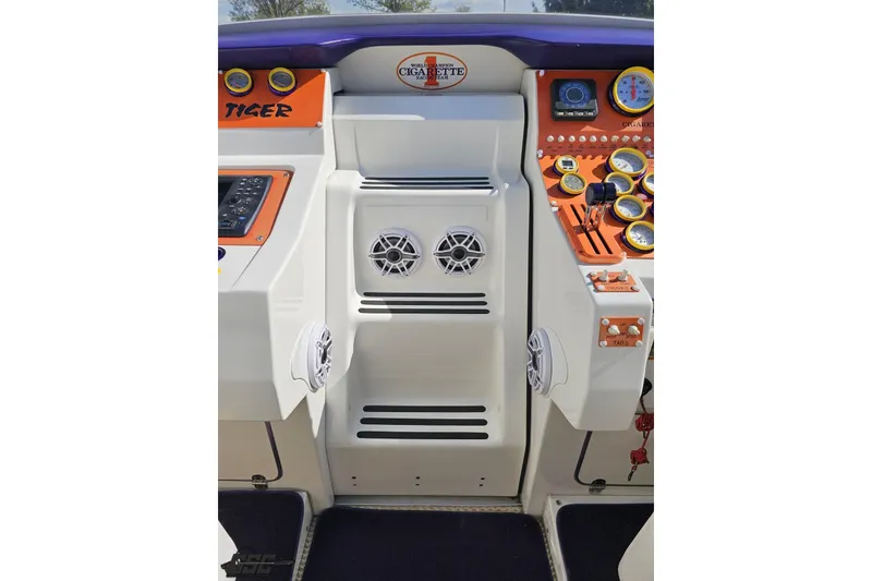 Slide: The Image of Cockpit of 2002 Cigarette 42' Tiger boat with gauges and controls. - 62