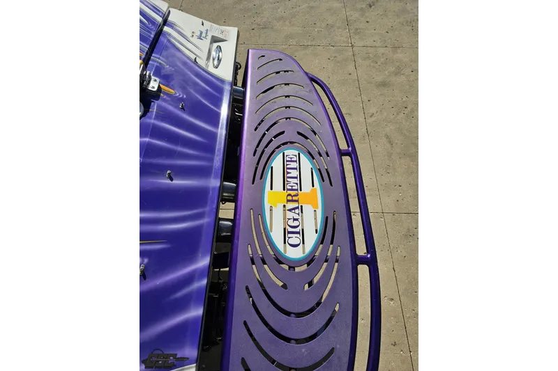 Slide: The Image of Purple 2002 Cigarette 42' Tiger boat with distinctive logo on deck. - 43