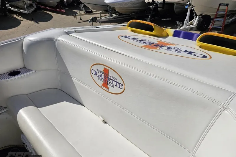 Slide: The Image of 2002 Cigarette 42' Tiger boat interior with branded seating and cup holder. - 55