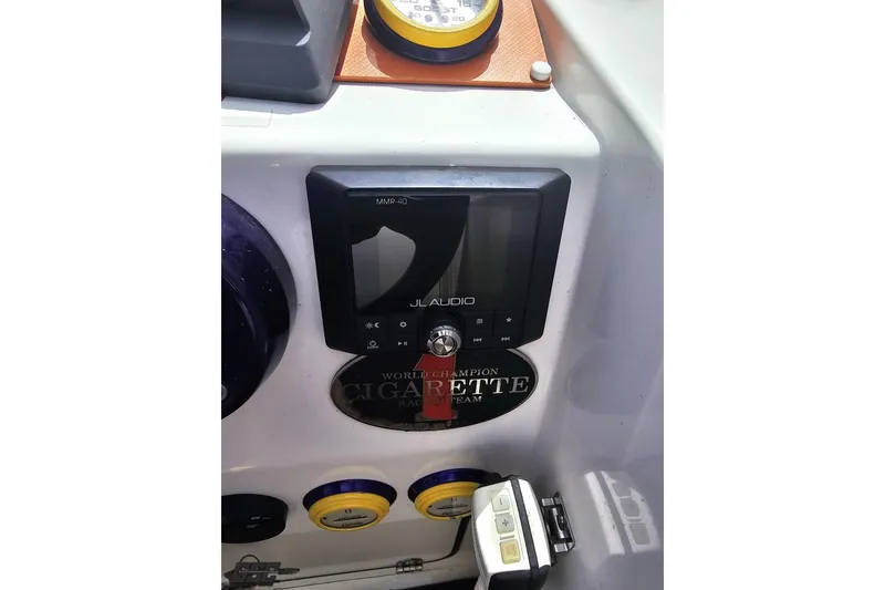Slide: The Image of Control panel of a 2002 Cigarette 42' Tiger boat featuring JL Audio system. - 67