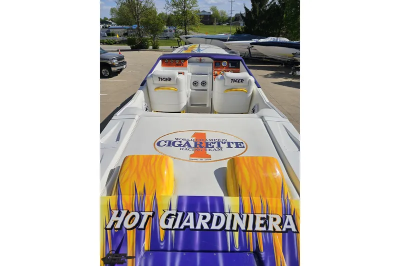 Slide: The Image of 2002 Cigarette 42' Tiger boat with vibrant graphics and "Hot Giardiniera" text. - 45